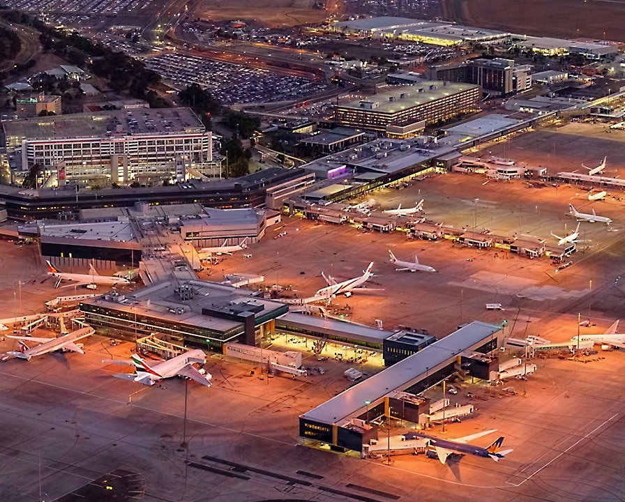 An aerial view of an airport at night.