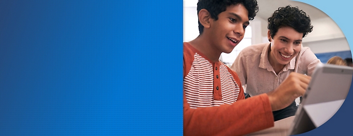 A couple of young men looking at a tablet