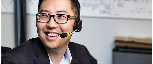A man wearing headphones and smiling