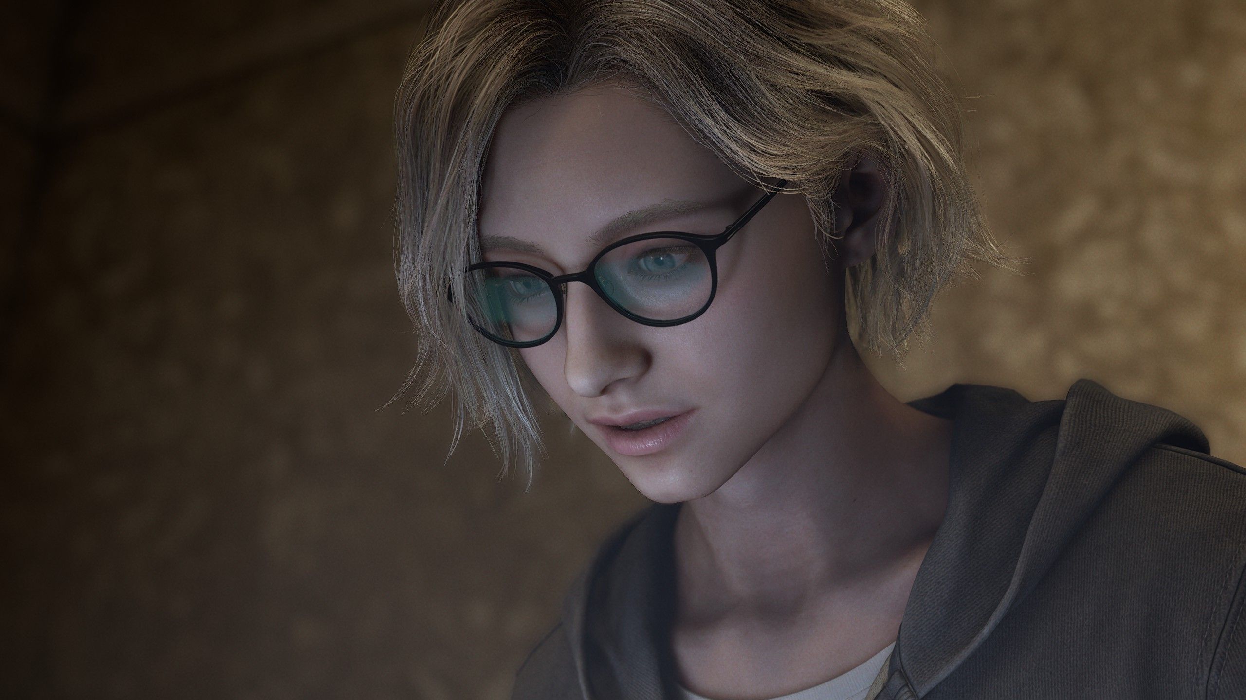 Young Grace, her glasses reflecting the light of her laptop screen