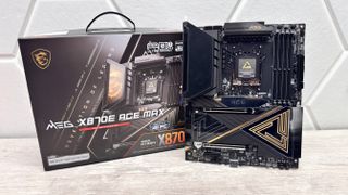 An MSI MEG X870E Ace Max motherboard on a desk.