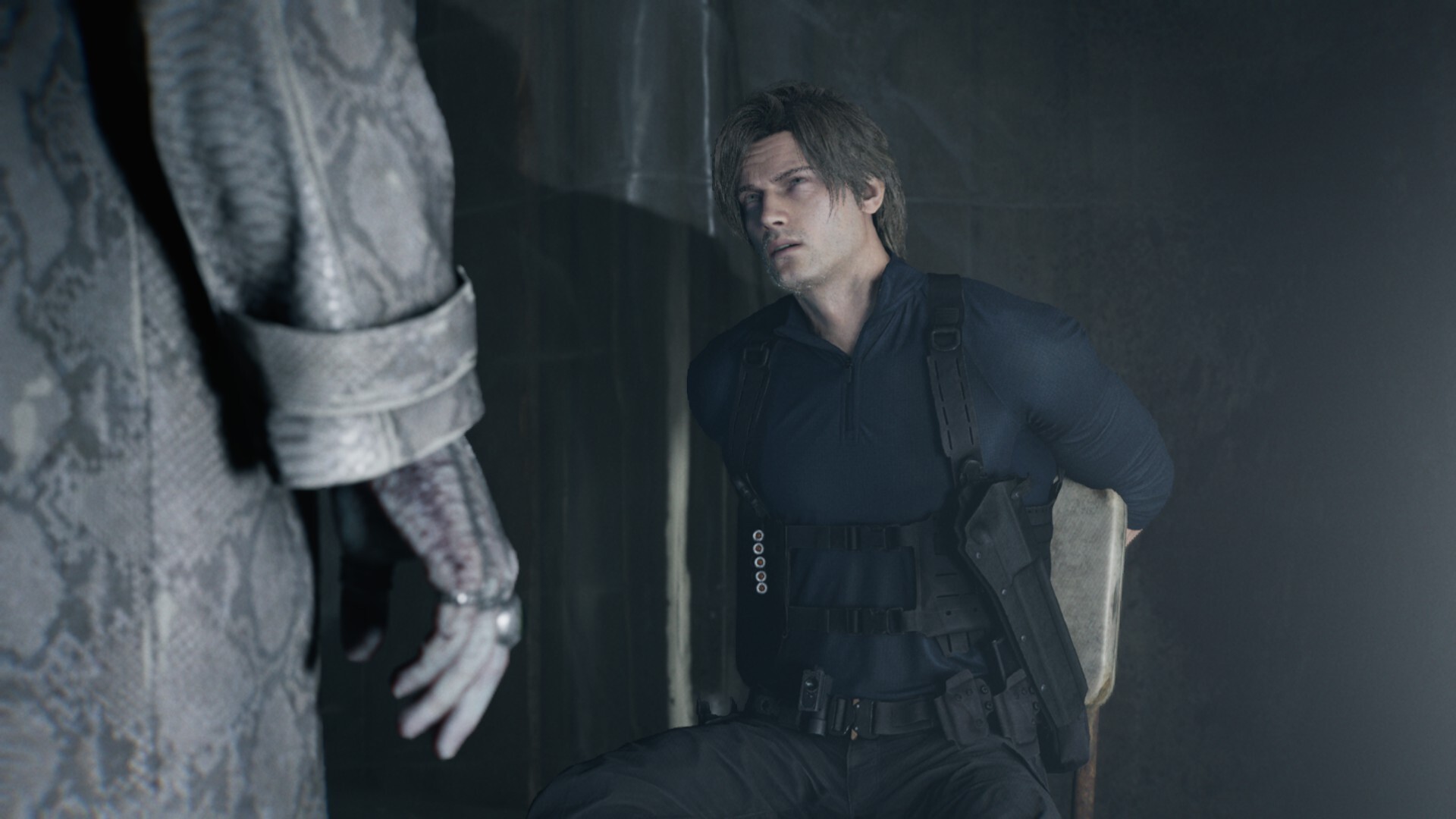 Leon tied to a chair