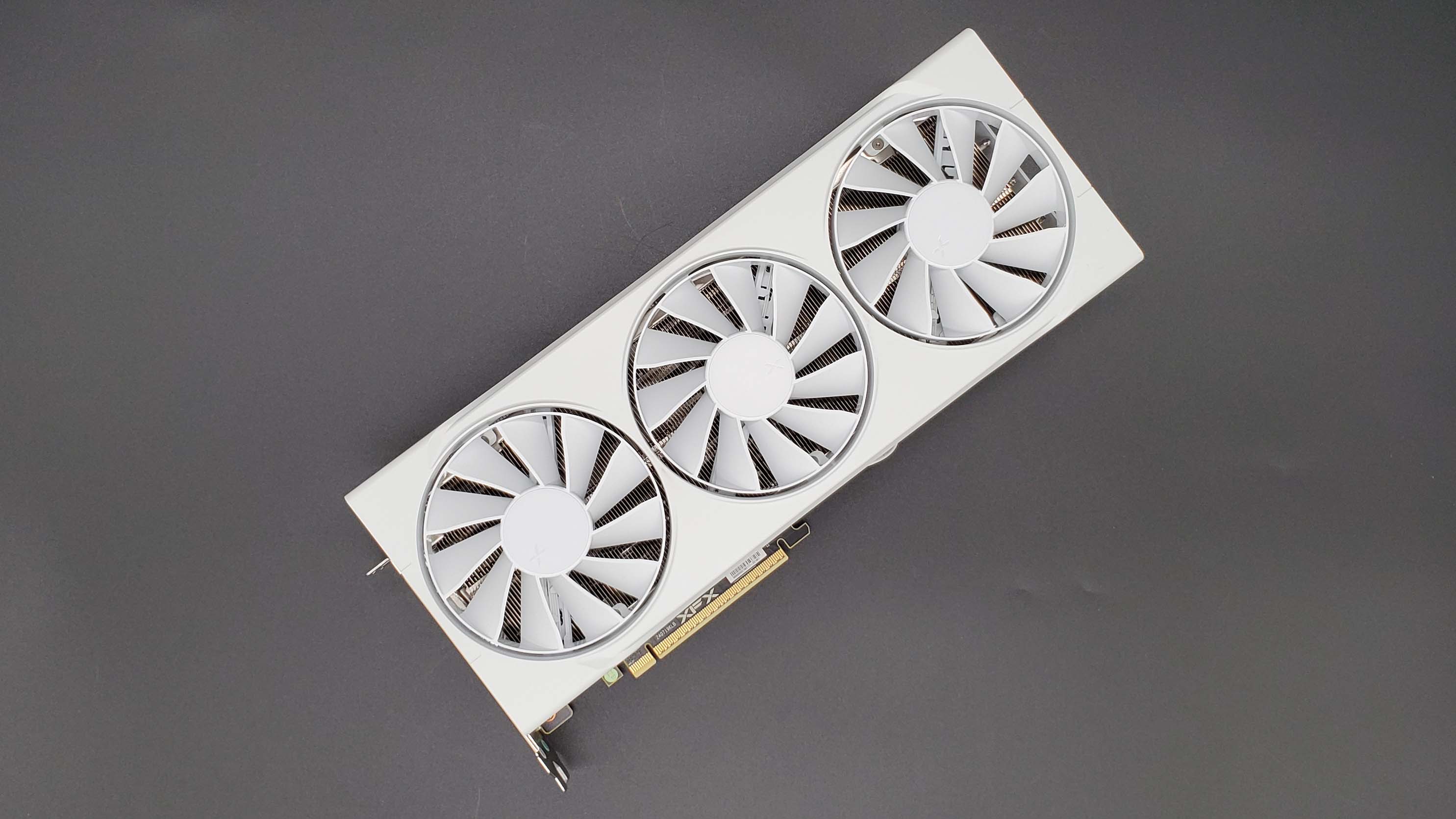 XFX Swift Radeon RX 9070 OC graphics card on a grey background with a gradient