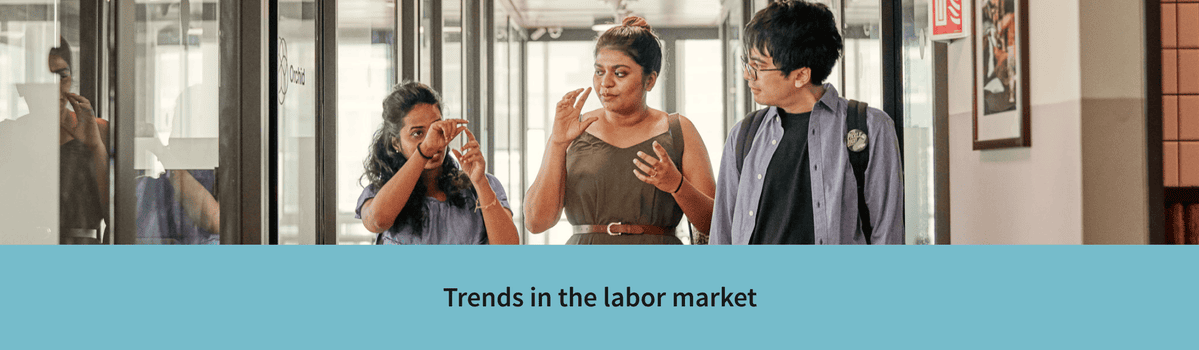 Trends in the labor market – Coworkers strategizing in a meeting.