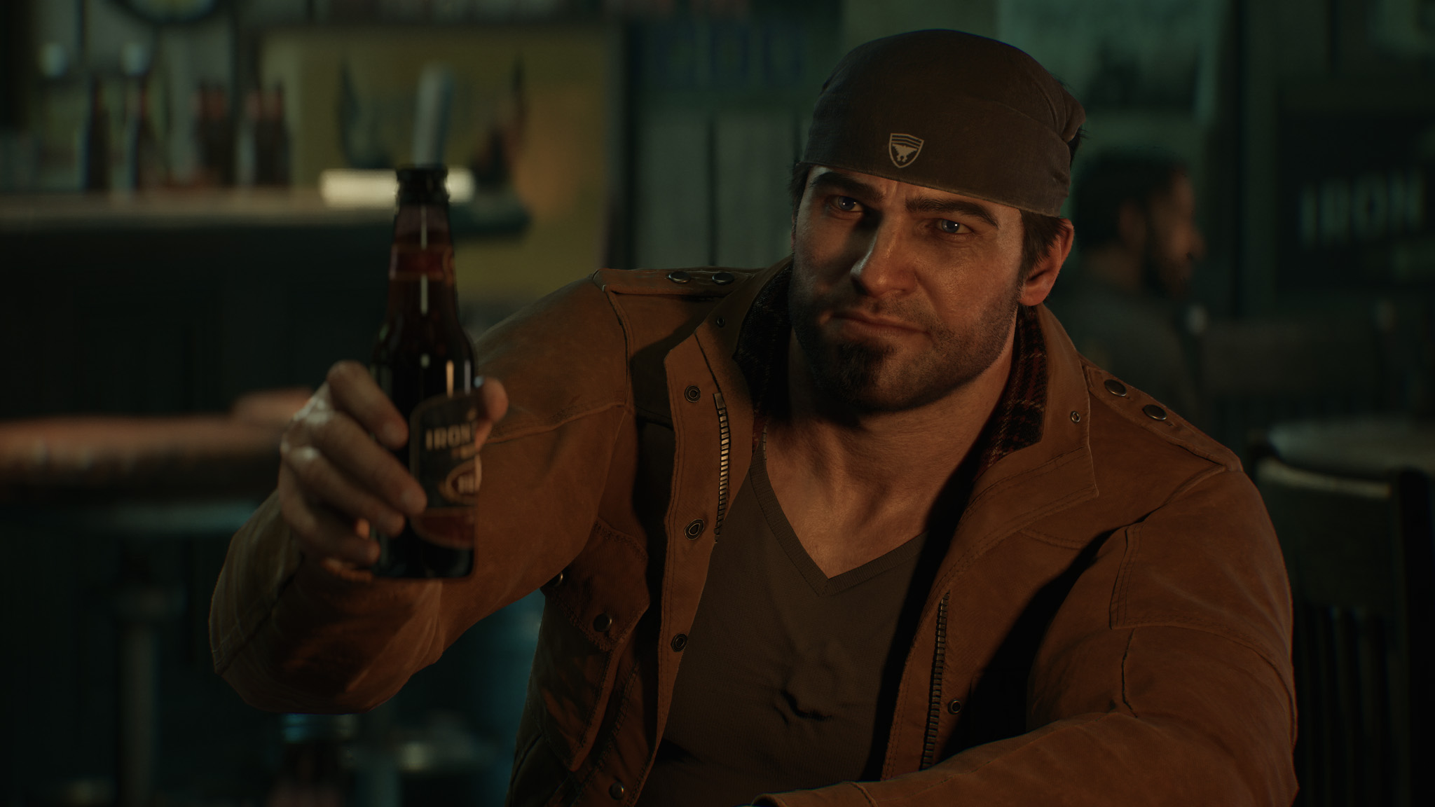 Marcus grabbing a bottle of beer and toasting