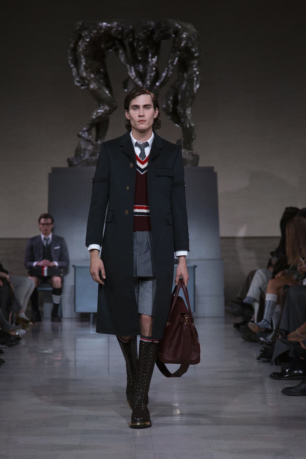 Image may contain Luke Edwards Clothing Coat Blazer Jacket Adult Person Accessories Bag Handbag and Overcoat