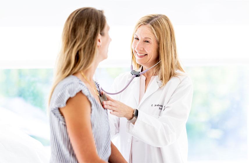 Cleveland Clinic doctor consulting a patient.